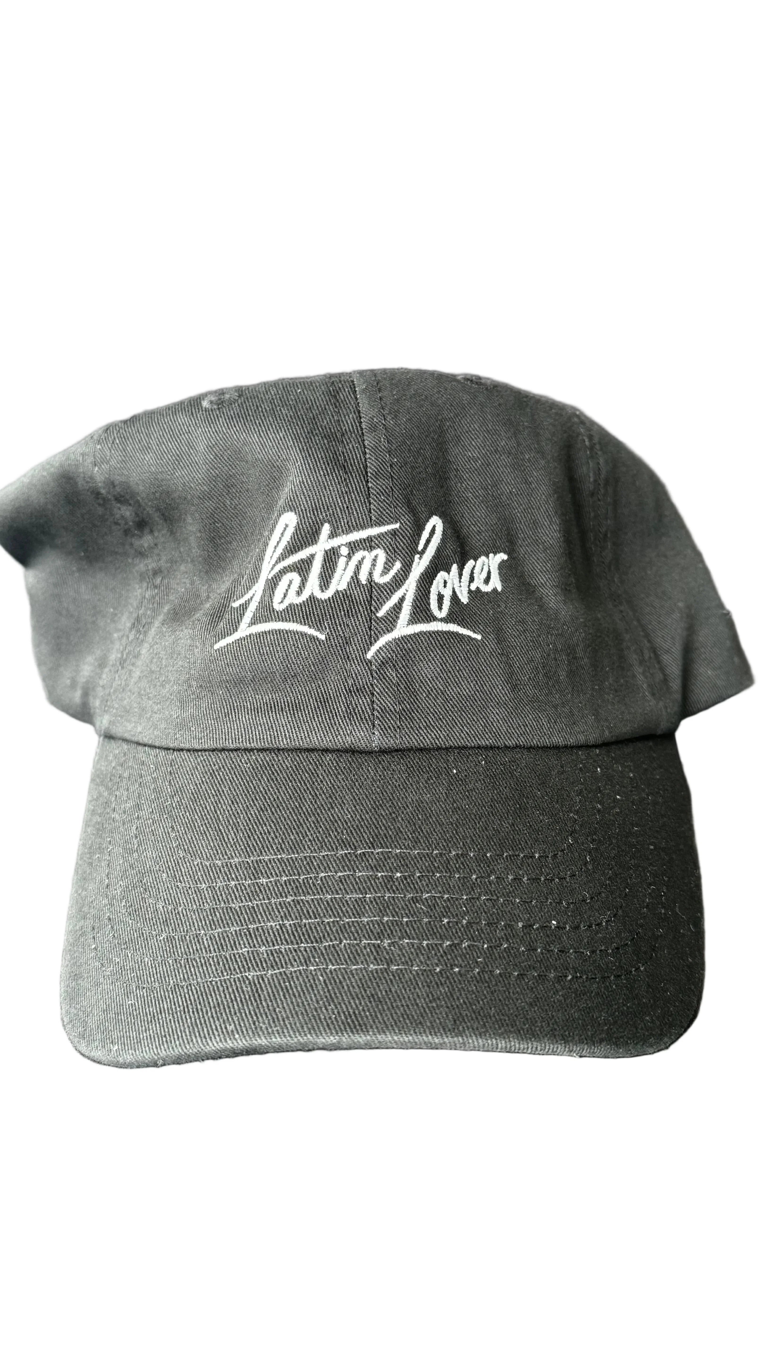 A black baseball cap with 'Latin Lover' embroidered in white script across the front