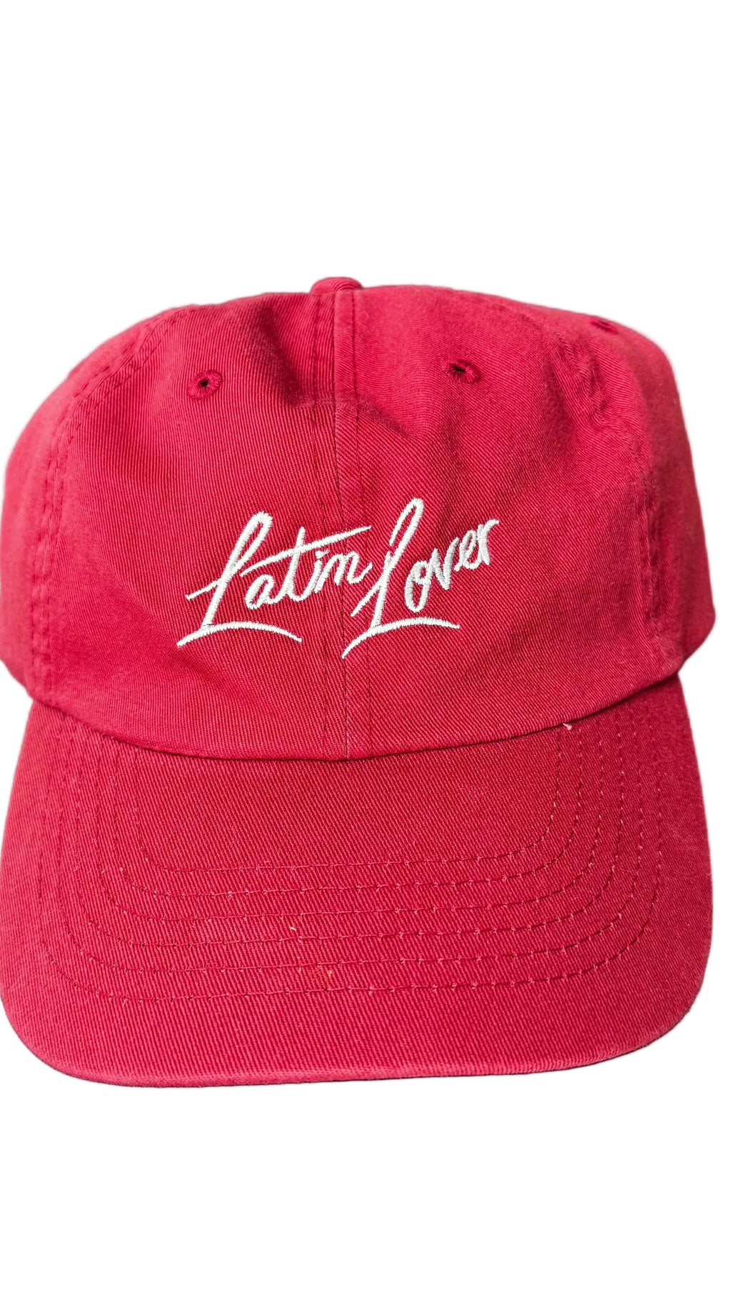 A red baseball cap with 'Latin Lover' embroidered in white script across the front.